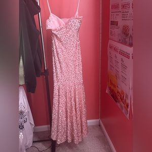 Prom dress size 6 but it was tailored a little bit. Light pink with sparkles